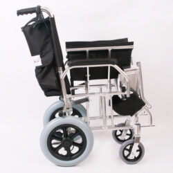 Side view of a compact travel wheelchair with black seat and silver frame.