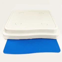 White stackable bath step with blue mat underneath.