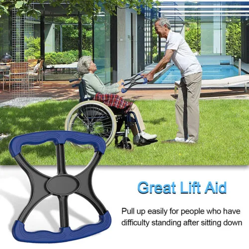 Elderly person in wheelchair using a manual stand aid with assistance.