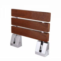 Teak wall-mounted folding shower seat with chrome brackets.