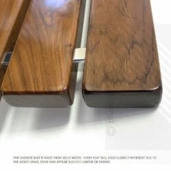 Close-up of teak shower seat showing wood grain and metal support.