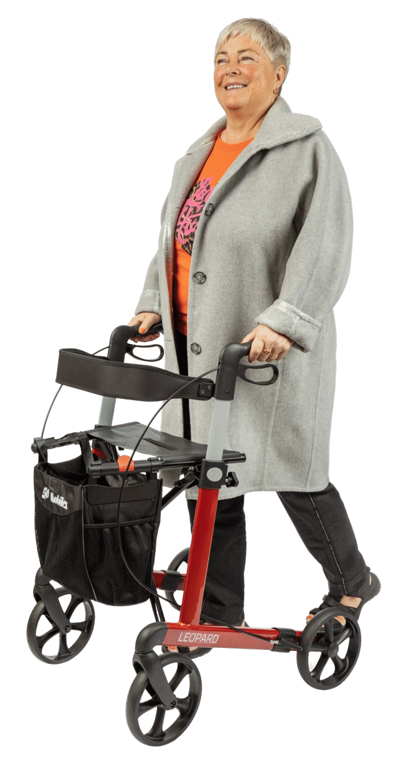 Person using a red Mobilex Leopard rollator with a shopping bag.