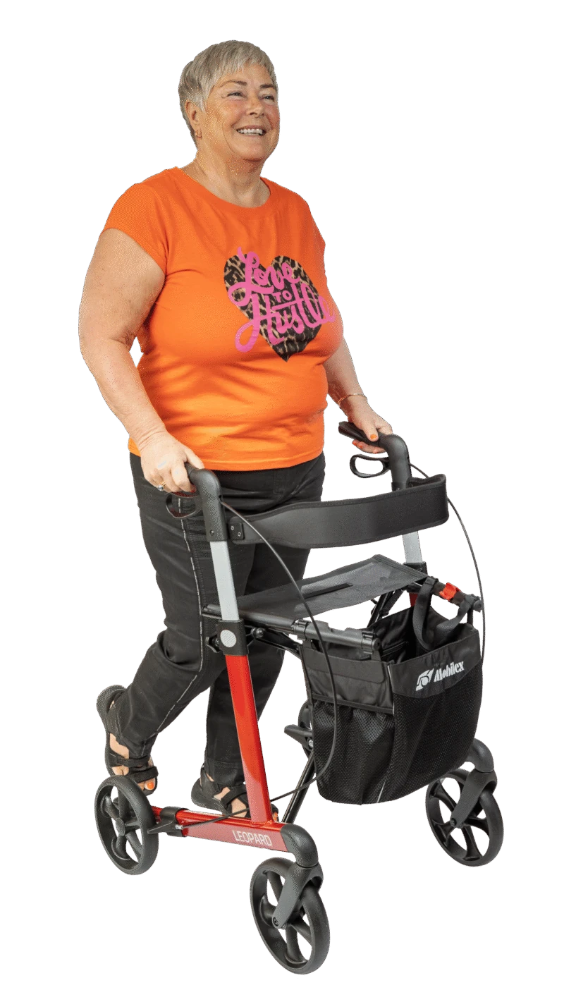Person using a red Mobilex Leopard rollator walker.