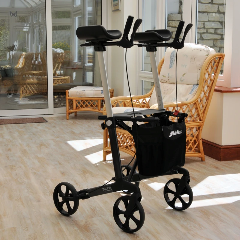 Tiger Indoor Rollator with black frame and armrests in a bright room.