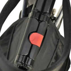 Close-up of folded rollator walker with red locking mechanism.