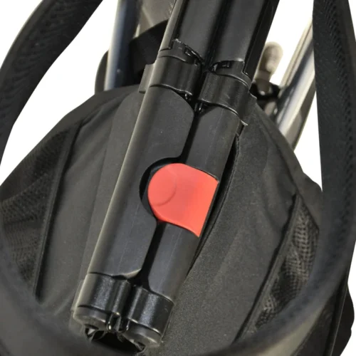 Close-up of folded rollator walker with red locking mechanism.