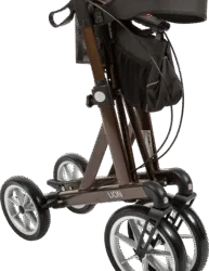 Folded Mobilex Lion rollator with large wheels and a shopping bag.