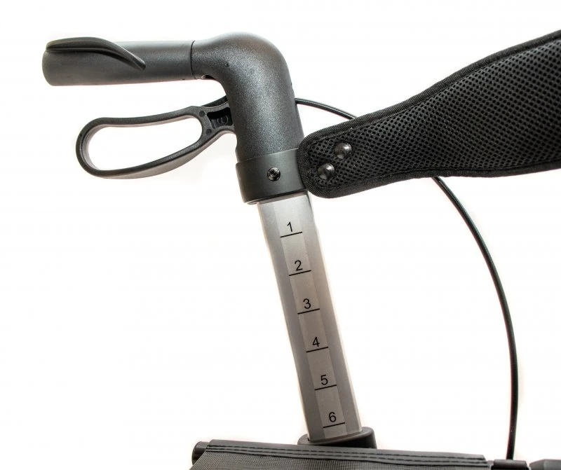 Close-up of rollator handle with height adjustment markings.