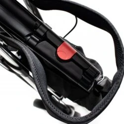 Close-up of folded Carbon Ultralight Rollator with red latch.