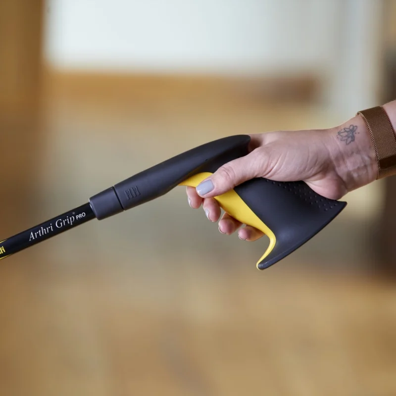 Close-up of a hand holding the Arthri-Grip PRO Reacher handle.
