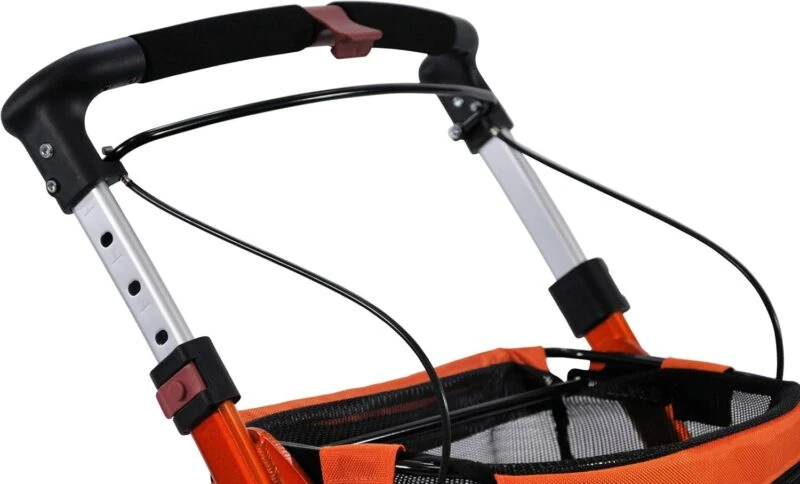 Close-up of the handle and storage area of an orange indoor rollator.