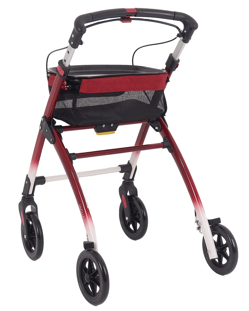 Red and white indoor rollator with tray and mesh bag.
