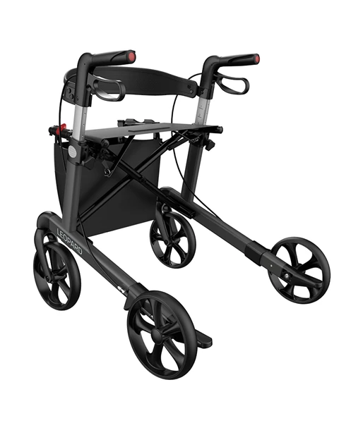 Anthracite grey rollator with four wheels and a padded back strap.