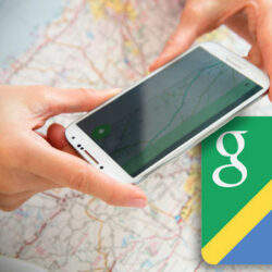 Person using a smartphone with a map and Google Maps logo.
