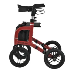 Red rollator with large wheels and a seat, side view.