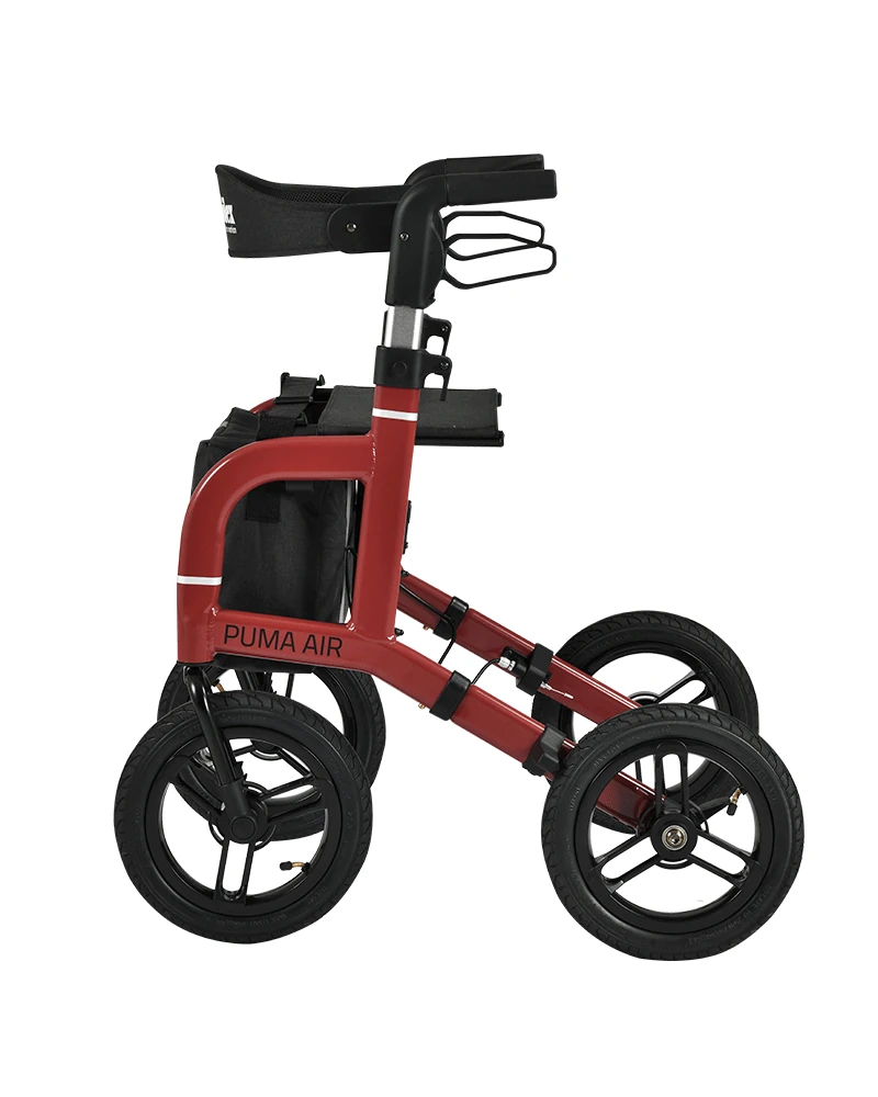 Red rollator with large wheels and a seat, side view.