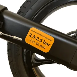 Close-up of a rollator wheel with a tyre pressure label.