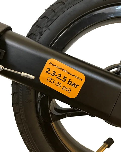 Close-up of a rollator wheel with a tyre pressure label.