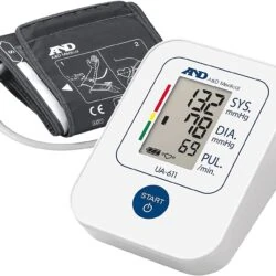 Digital blood pressure monitor with cuff and display showing readings.