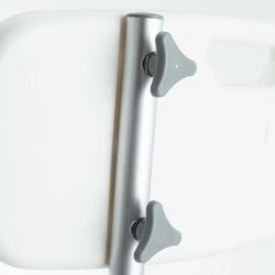 Close-up of adjustable arm mechanism on a shower chair.
