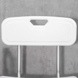 Close-up of the white backrest of a shower chair with a handle.