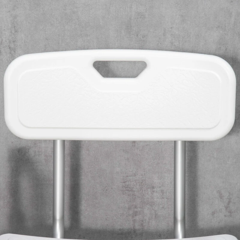 Close-up of the white backrest of a shower chair with a handle.