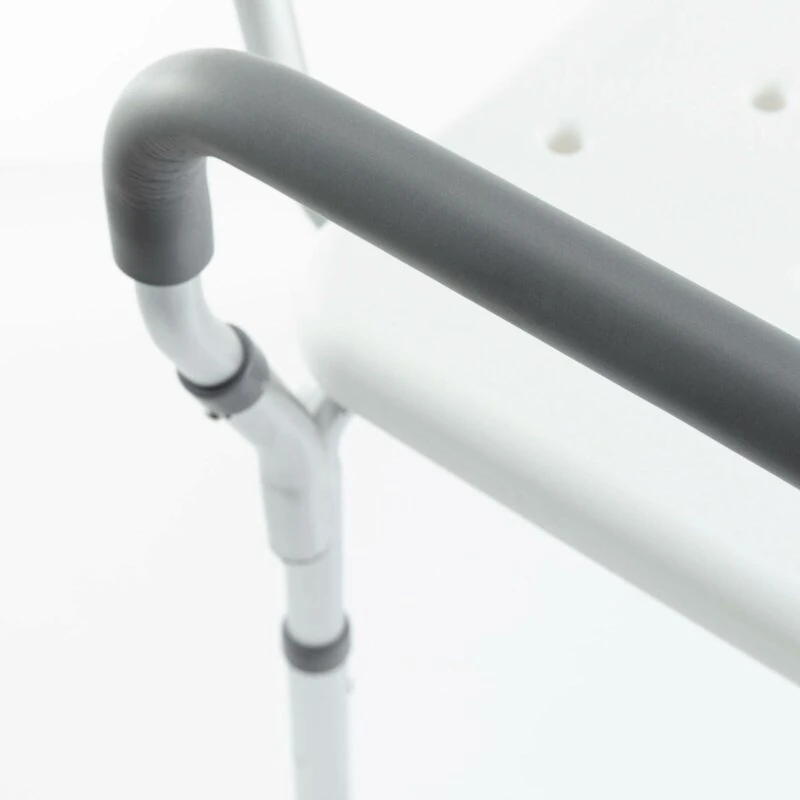 Close-up of a shower chair armrest with adjustable height.