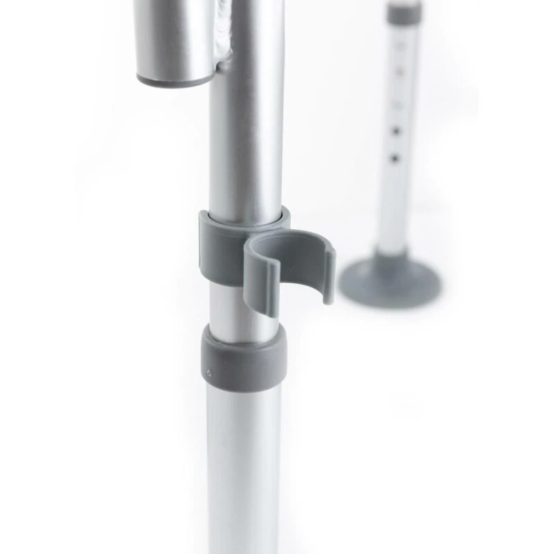 Close-up of adjustable shower chair leg with gray clamp.