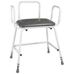 White frame stool with grey padded seat and armrests.