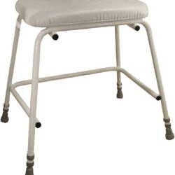 Height adjustable perching stool with padded seat and sturdy frame.