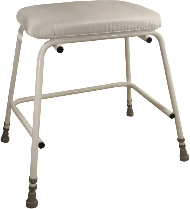 Height adjustable perching stool with padded seat and sturdy frame.