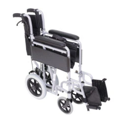 Folded lightweight transit wheelchair with swing away footrest.
