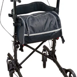 Forearm 4 wheeled rollator with a detachable shopping bag and adjustable handles.