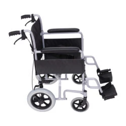 Side view of a compact aluminum transit wheelchair with black upholstery.