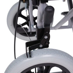 Close-up of a wheelchair's brake system and puncture-proof rear wheel.