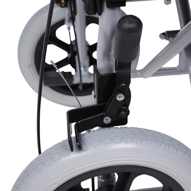 Close-up of a wheelchair's brake system and puncture-proof rear wheel.