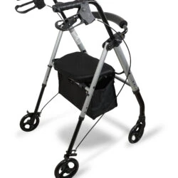 Silver rollator with four wheels, padded seat, and under-seat storage.
