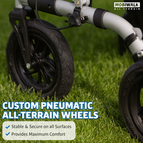 Close-up of MobiWalk rollator's pneumatic wheel on grass.