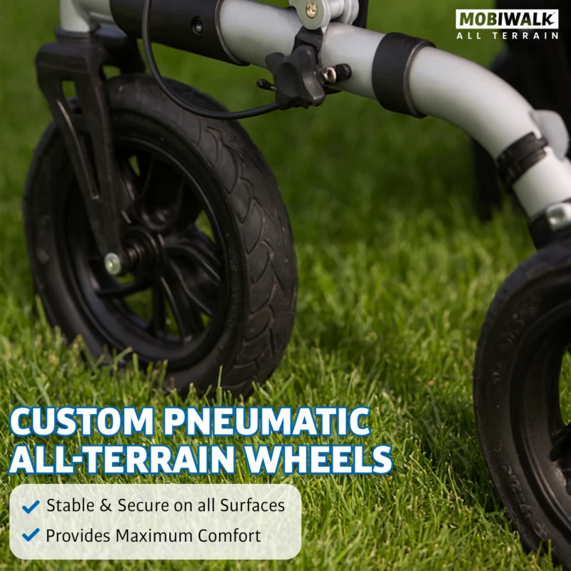 Close-up of MobiWalk rollator's pneumatic wheel on grass.