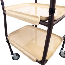 Close-up of a two-tier beige trolley with wheels and tubular steel frame.