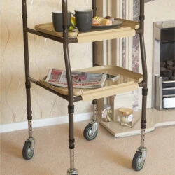 Height adjustable indoor trolley with two trays and wheels.