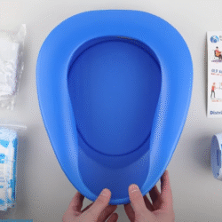 Blue bedpan with liners, pouches, and instruction sheet.
