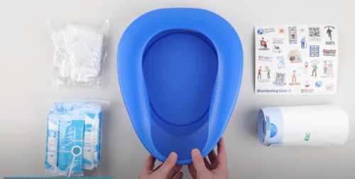 Blue bedpan with liners, pouches, and instruction sheet.