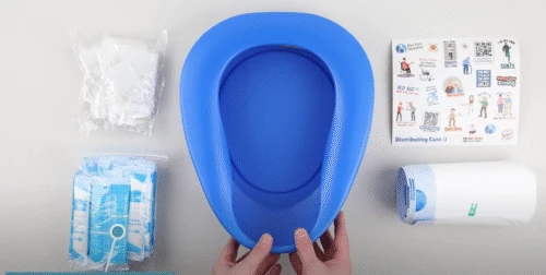 Blue bedpan with liners, pouches, and instruction sheet.