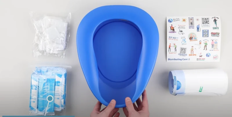 Blue bedpan with liners, pouches, and instruction sheet.
