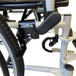 Close-up of wheelchair frame and brake mechanism.