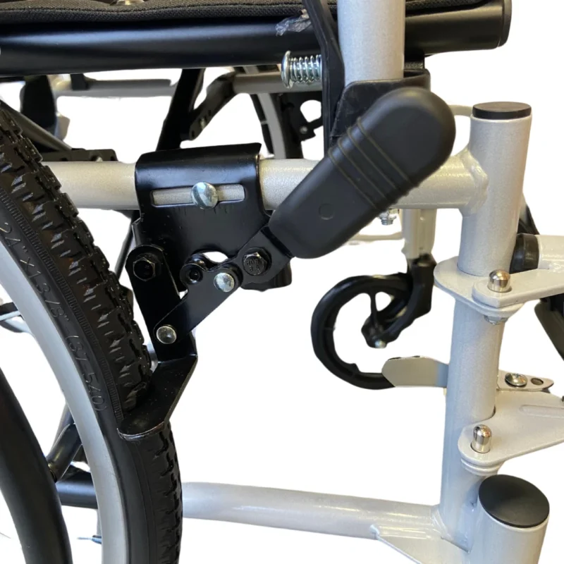 Close-up of wheelchair frame and brake mechanism.
