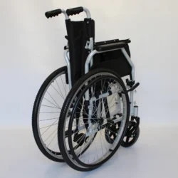 Folded self-propelled wheelchair with black seat and silver frame.