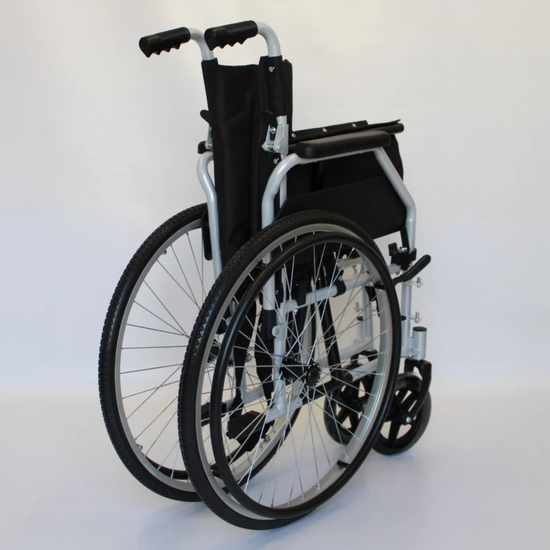 Folded self-propelled wheelchair with black seat and silver frame.