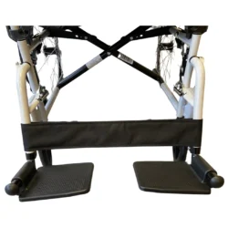 Close-up view of wheelchair footrests and frame.